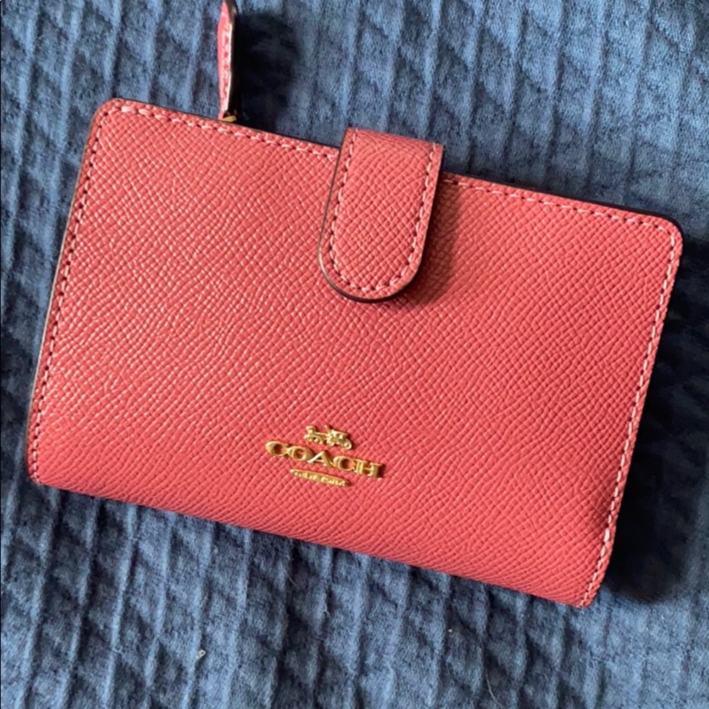 Pink Coach wallet.